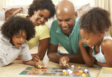 family playing board game. The Omaha Mom