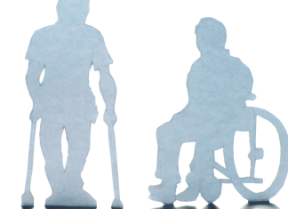 shadow of person in wheelchair and with crutches. disability