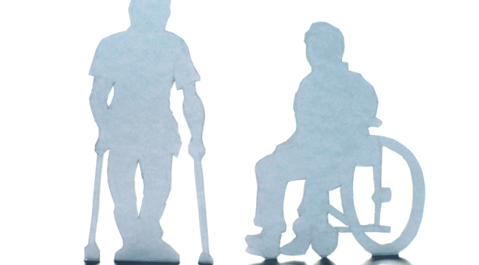 shadow of person in wheelchair and with crutches. disability