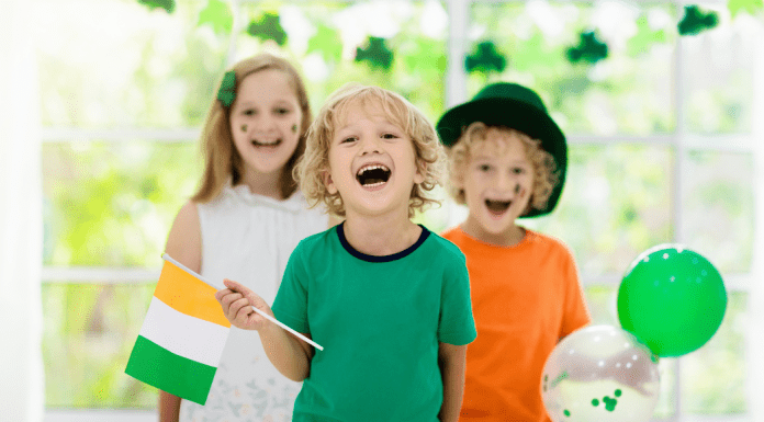 3 kids holding irish flag St Patricks Day Omaha Mom